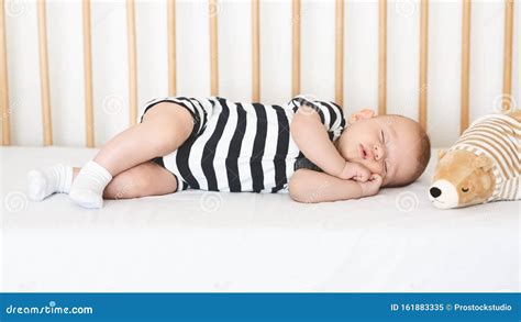 baby spinning in crib|baby sleeping on side of crib.